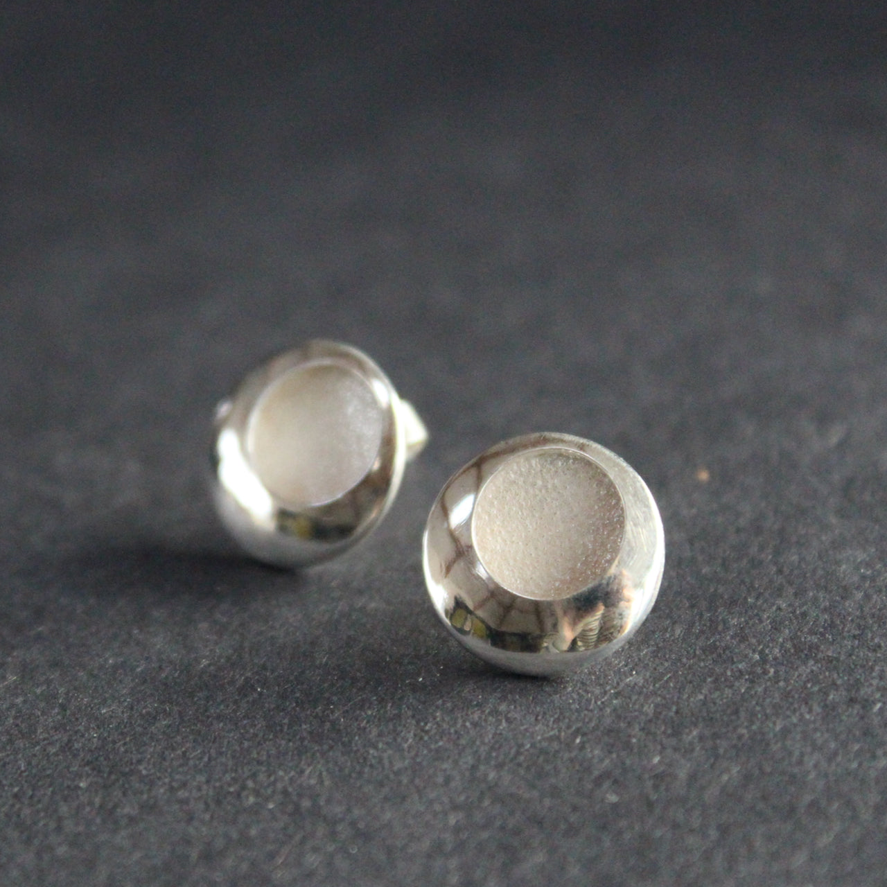silver earrings with a textured centre by beverly bartlett, jewellery designer