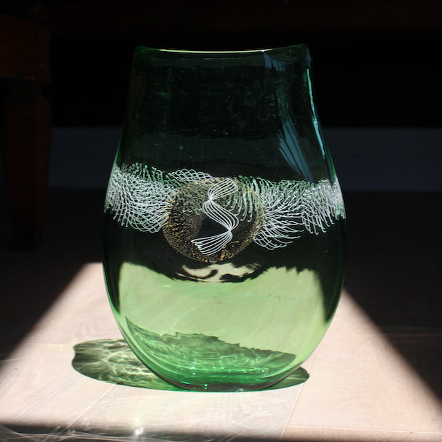 green glass vessel with centre detail by Benjamin Lintell  photographed in sunlight