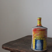 red, yellow and blue ceramic bottle by UK ceramicist John Pollex