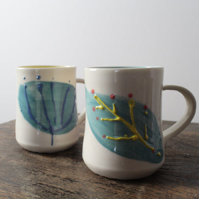 porcelain decorated mugs by Helen Harrison 