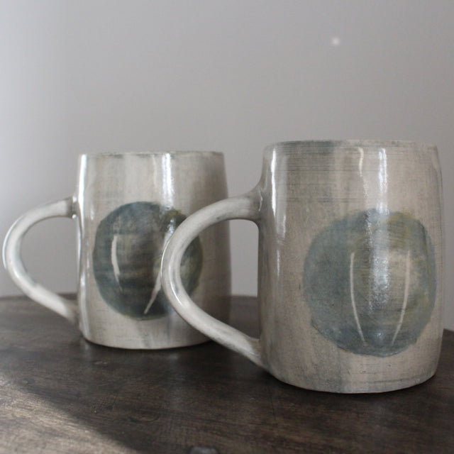 a pair of ceramic mugs by Kate Welton.