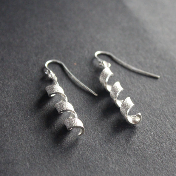 pair of silver helix twisted earrings by Beverly Bartlett by Uk jewellery designer 
