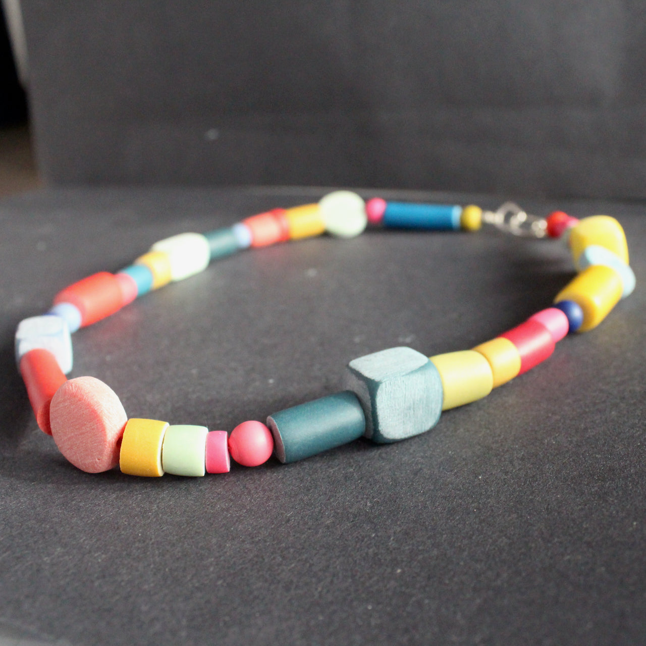 a multi coloured random shaped bead necklace by jewellery designer Clare Lloyd.
