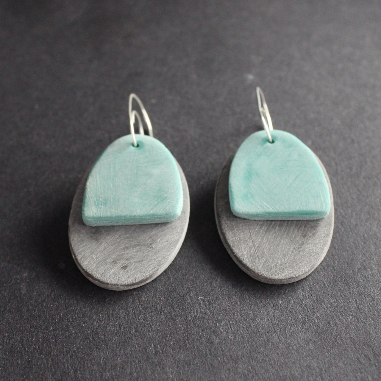 oval shaped earrings in grey and green by jewellery designer Clare Lloyd