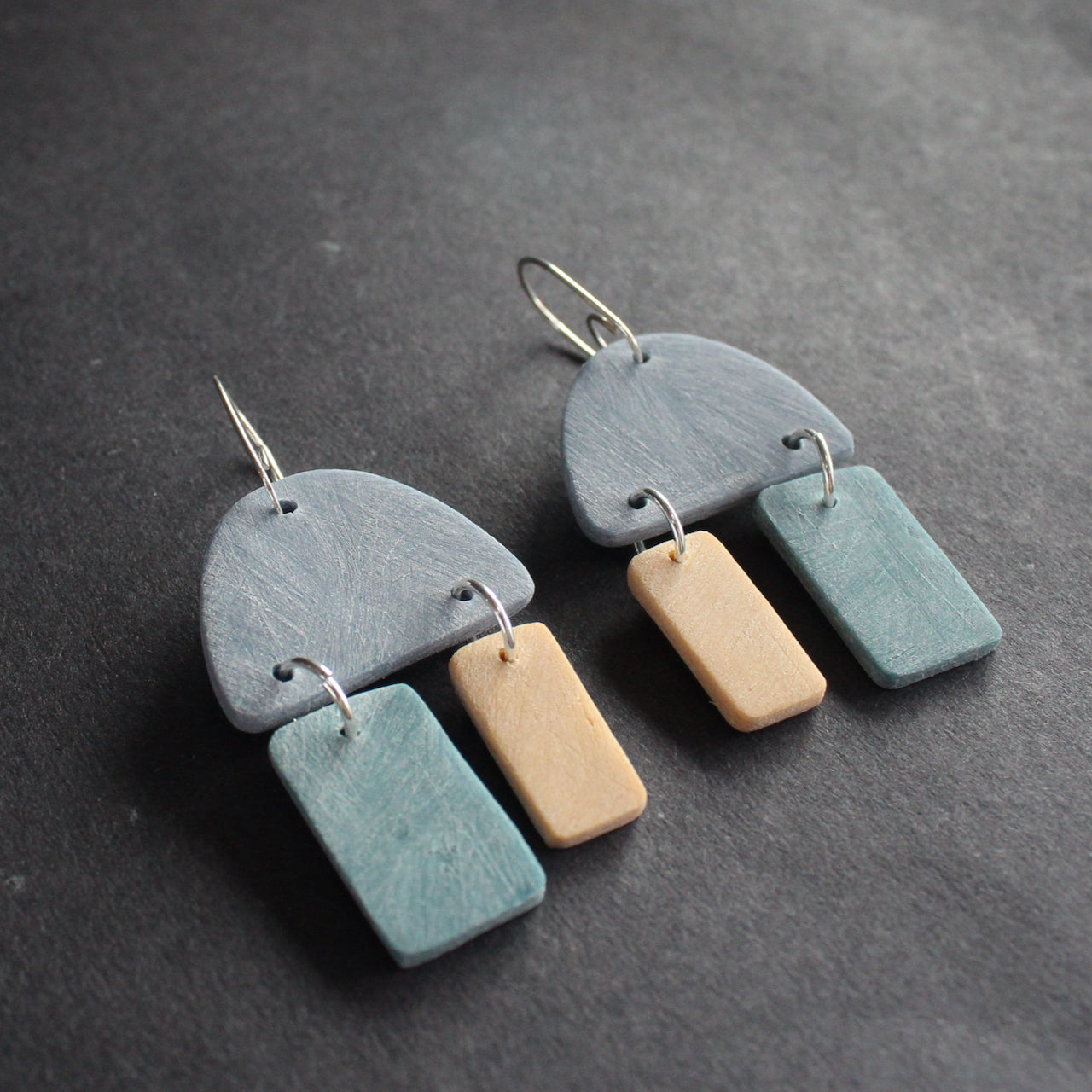  earrings in blue, turquoise and pale yellow by jewellery designer Clare Lloyd 