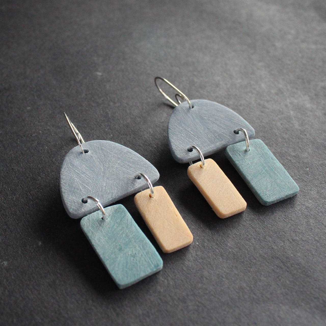 earrings in blue, turquoise and pale yellow by jewellery designer Clare Lloyd