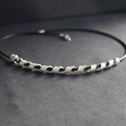 silver helix twisted necklace on black leather band by UK jeweller Beverly Bartlett