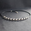 a silver helix twisted necklace on black leather band by Beverly Bartlett, UK jewellery designer 
