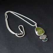 Sphene and blue tourmaline textured silver duo pendants on silver chain by Carin Lindberg