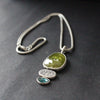 Sphene and blue tourmaline textured silver duo pendants by Carin Lindberg