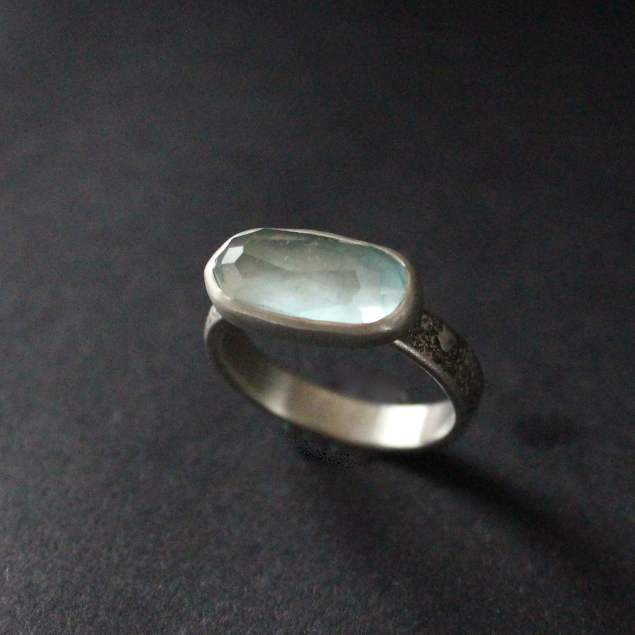 textured silver ring with blue stone by jeweller Carin Lindberg
