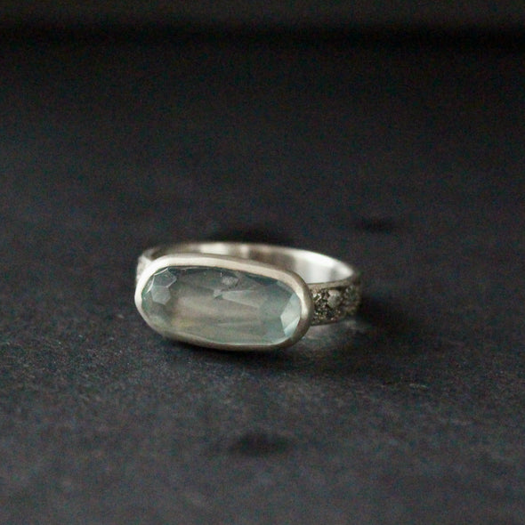 a textured silver ring with blue stone by jeweller Carin Lindberg.
