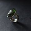 a three banded silver ring with a dark green stone by jeweller Carin Lindberg