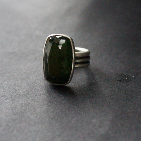 three banded silver ring with a dark green stone by Cornwall baed jeweller Carin Lindberg.