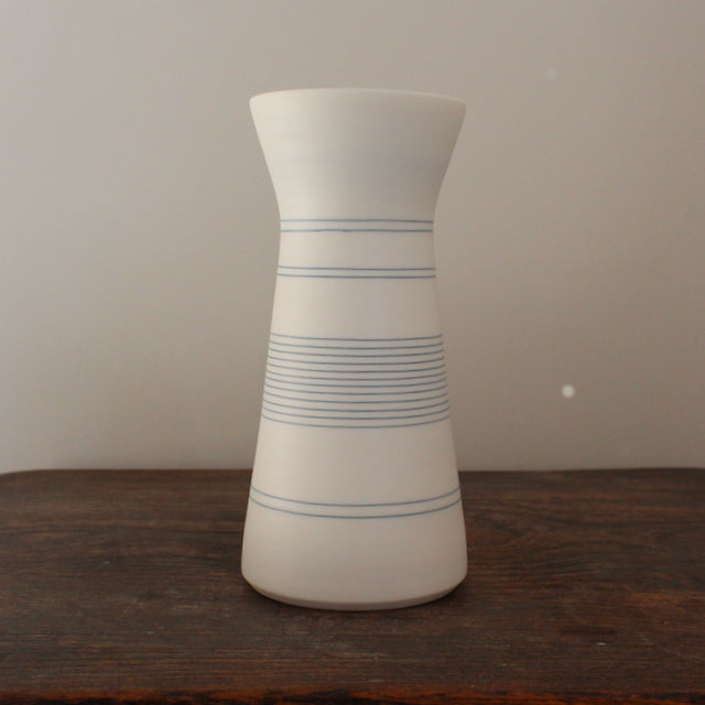 white porcelain vase with blue ring design by Uk potter Kathryn Sherriff of By the Line Pottery 