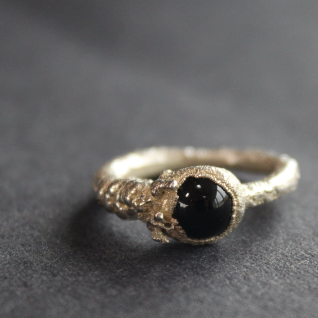 textured silver ring with dark blue stone by jeweller Libby Ward
