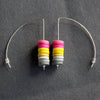 earrings made of small discs on top of each other in pink, yellow and grey by UK jewellery designer Clare Lloyd 