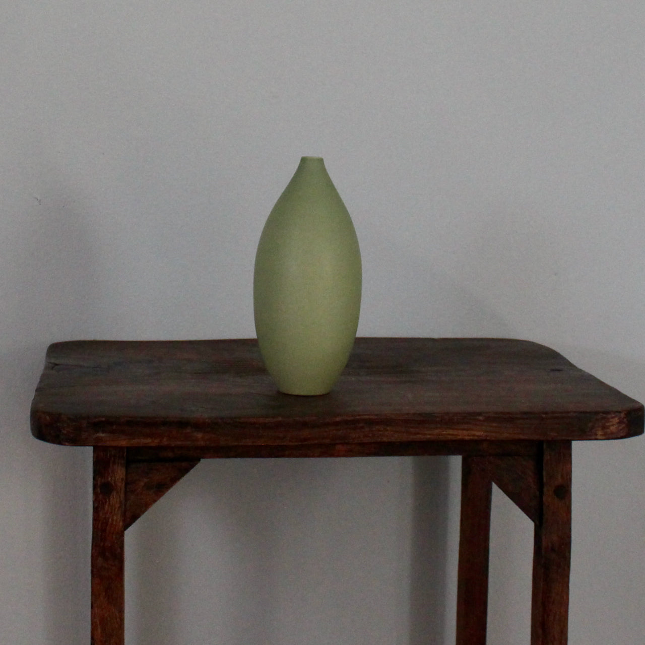 Green oval vase by UK ceramic artist Lucy Burley.