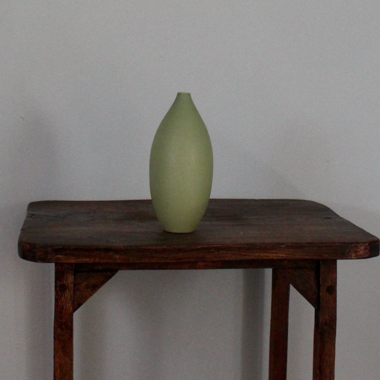  Green oval vase by UK ceramic artist Lucy Burley.