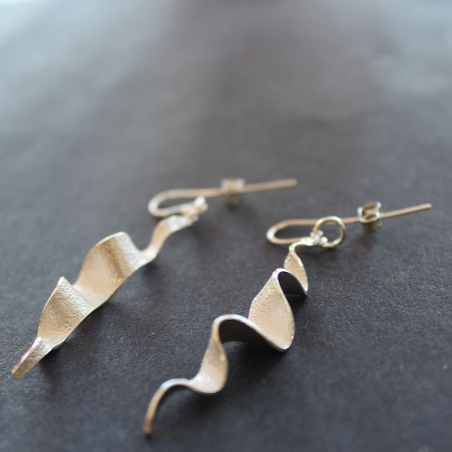 Silver wave like drop earrings by Beverly Bartlett