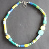 a random shaped necklace in blues and greens by Clare Lloyd, UK Jewellery Designer.
