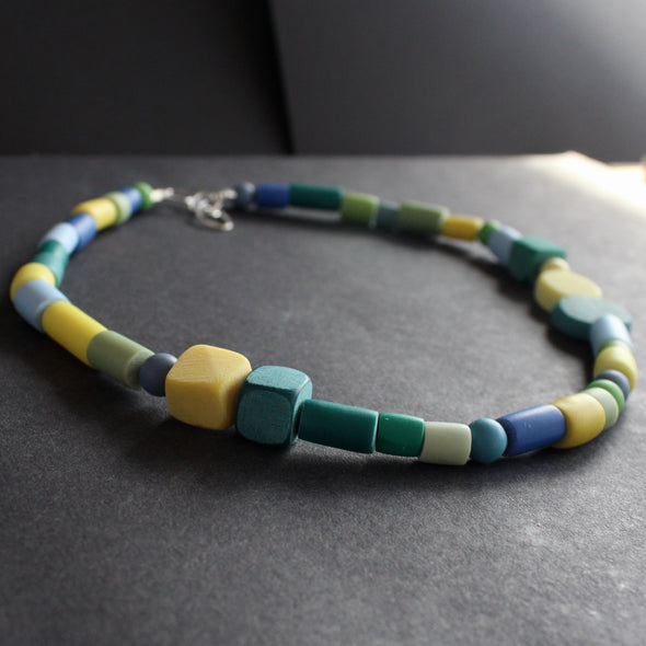 random shaped necklace in blues and greens by Clare Lloyd,  Jewellery Designer.