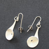 Textured silver curved and circular earrings by Beverly Bartlett