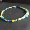 A random shaped necklace in yellows, blues and greens by Clare Lloyd, UK Jewellery Designer