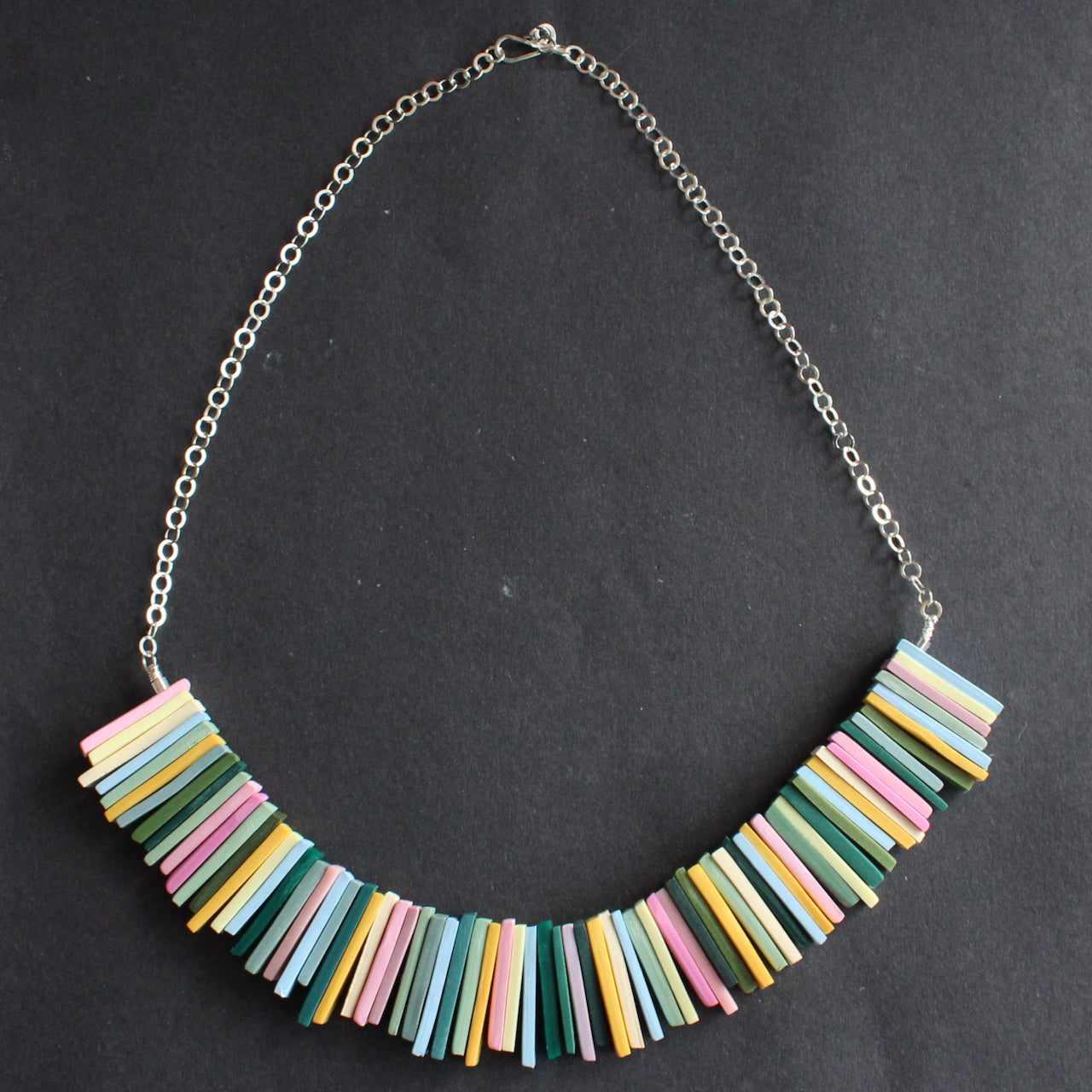  a necklace in pinks, yellow and green oblong beads by UK  jeweller Clare Lloyd 