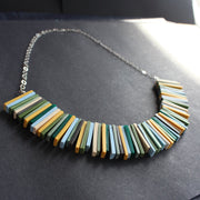 Modern deco necklace with greens, yellows and blues by Clare Lloyd