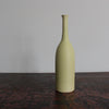 a ceramic bottles almond green by UK potter Lucy Burley .
