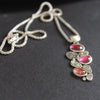 silver pendant with silver discs and pink tourmaline stones on a sliver chain by UK Jewellery Designer Carin Lindberg 