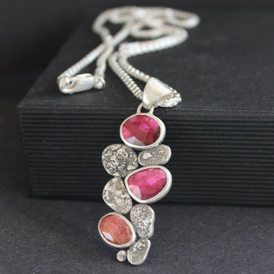 silver pendant with silver discs and pink tourmaline stones on a sliver chain by Jewellery Designer Carin Lindberg.