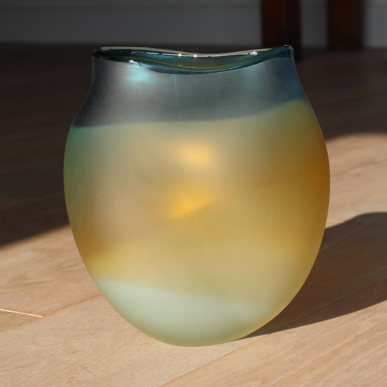 Michele Oberdieck glass artist's tulip shaped glass vessel in opaque blue and amber glass