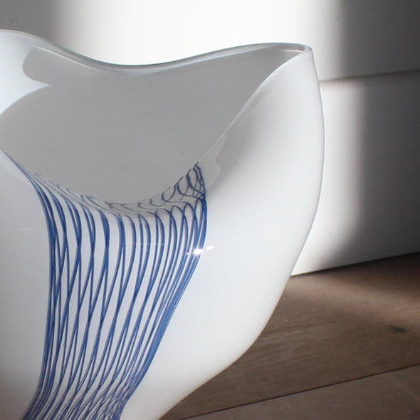 Detail of glass buckled vessel in white and blue by Benjamin Lintell