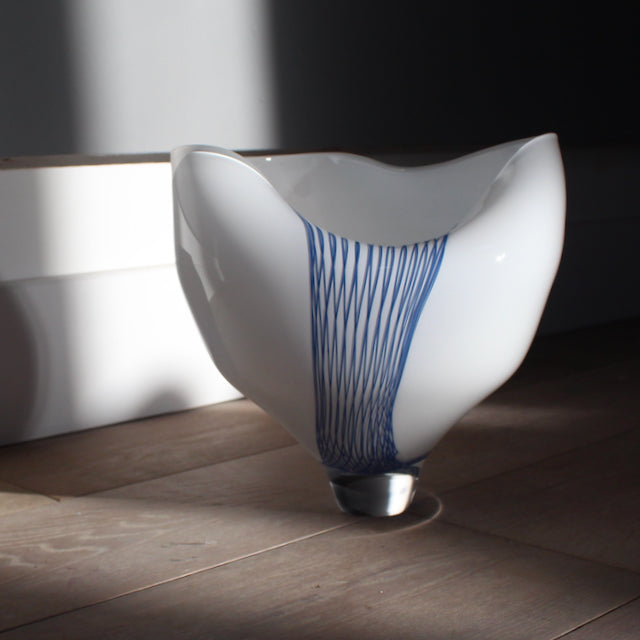 Glass buckled vessel in white and blue by Benjamin Lintell