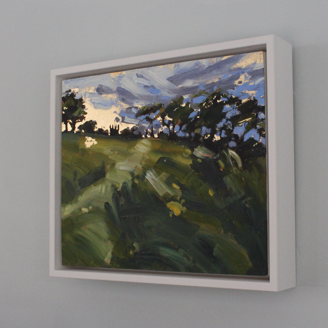 Cornwall artist Jill Hudson painting of a field with dark trees and a blue and purple sky