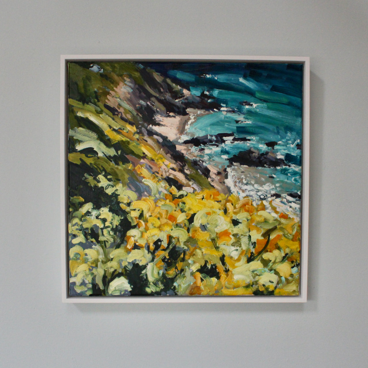 framed Jill Hudson painting in vibrant colours of footpath down the beach and sea in Cornwall.