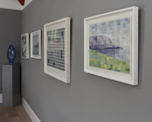 Abstract paintings on a grey wall