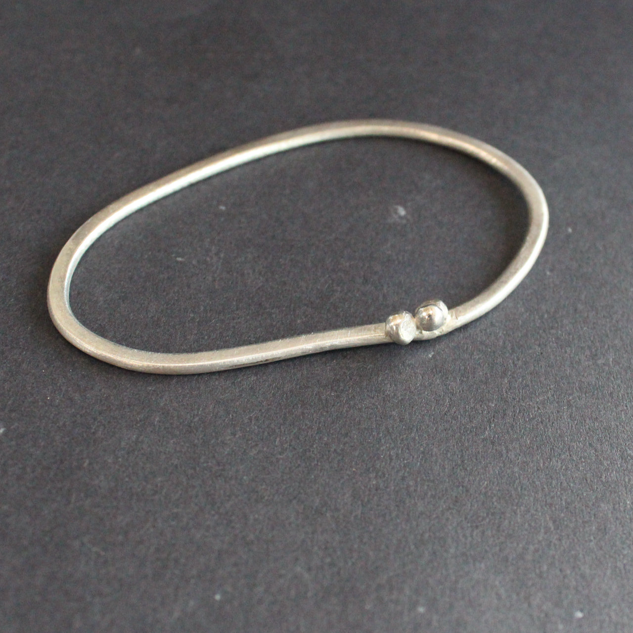silver bangle by UK jeweller Lizzie Weir of Anatole Design