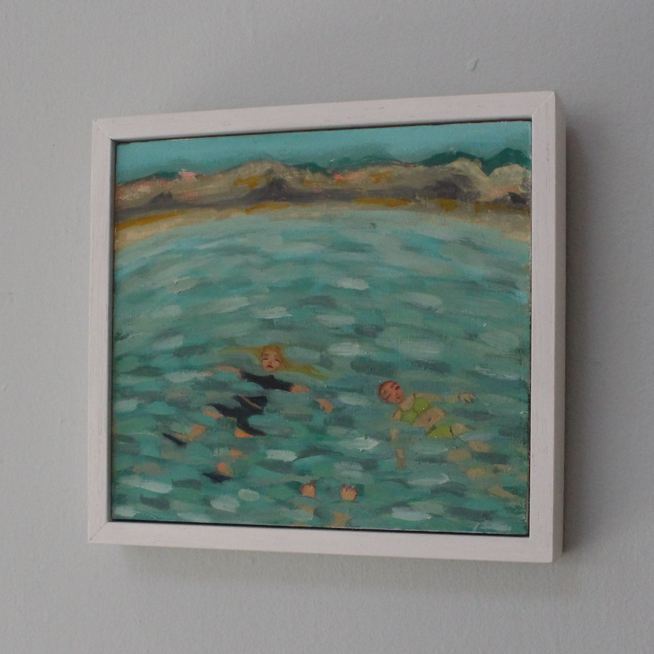 framed painting of people floating in blue and turquoise water by Cornish artist Siobhan Purdya painting of people floating in blue and turquoise water by  artist Siobhan Purdy