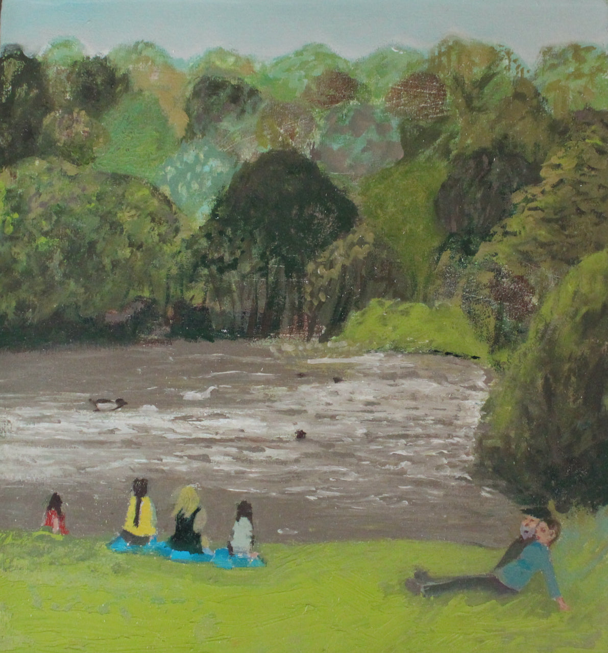 painting by Cornish artist Siobhan Purdy of people sitting on the grass in front of a lake in Cornwall 