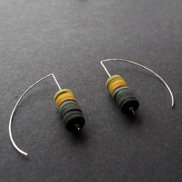  a pair of earrings made by Clare Lloyd from small multicoloured discs on silver wire 