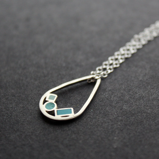 silver necklace with blue details