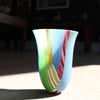a glass vase in green and blue with pink stripe by  Ruth Shelley UK glass artist.