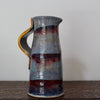 a ceramic jug in blue and red glaze by UK potter John Pollex.