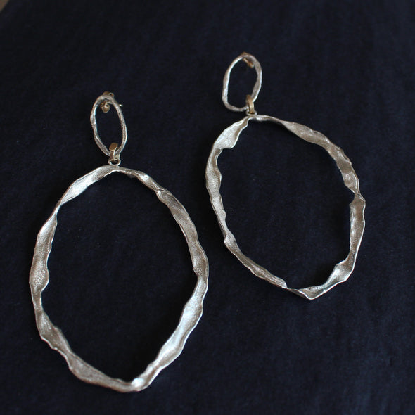 Organically sculpted two hoop sliver textured earrings by Cornish jewellery designer Claire Stockings-Baker