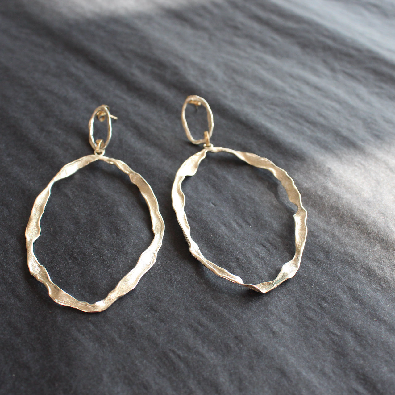 Handmade sliver earrings with two wave inspired hoops by Cornish jewellery designer Claire Stockings-Baker