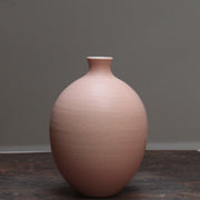Pale pink oval shaped ceramic bottle by Lucy Burley at the Byre Gallery