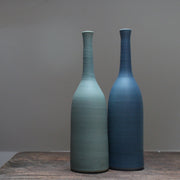 Two ceramic bottles one pale teal, the other darker teal by Lucy Burley at the Byre Gallery